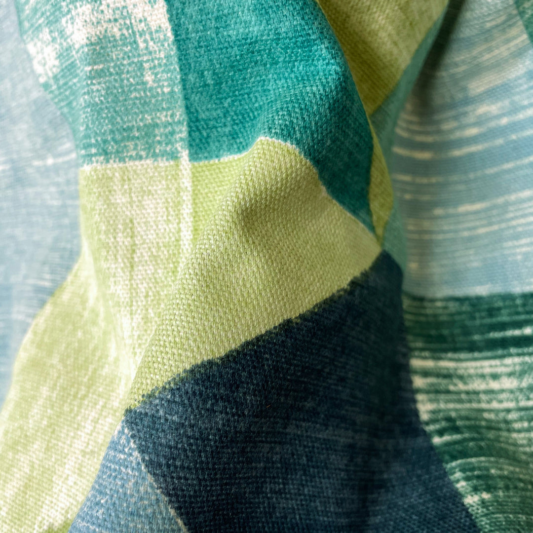 Close-up fabric swatch of Emerald Mosaic Canvas, an emerald mosaic pattern printed on lightweight cotton canvas