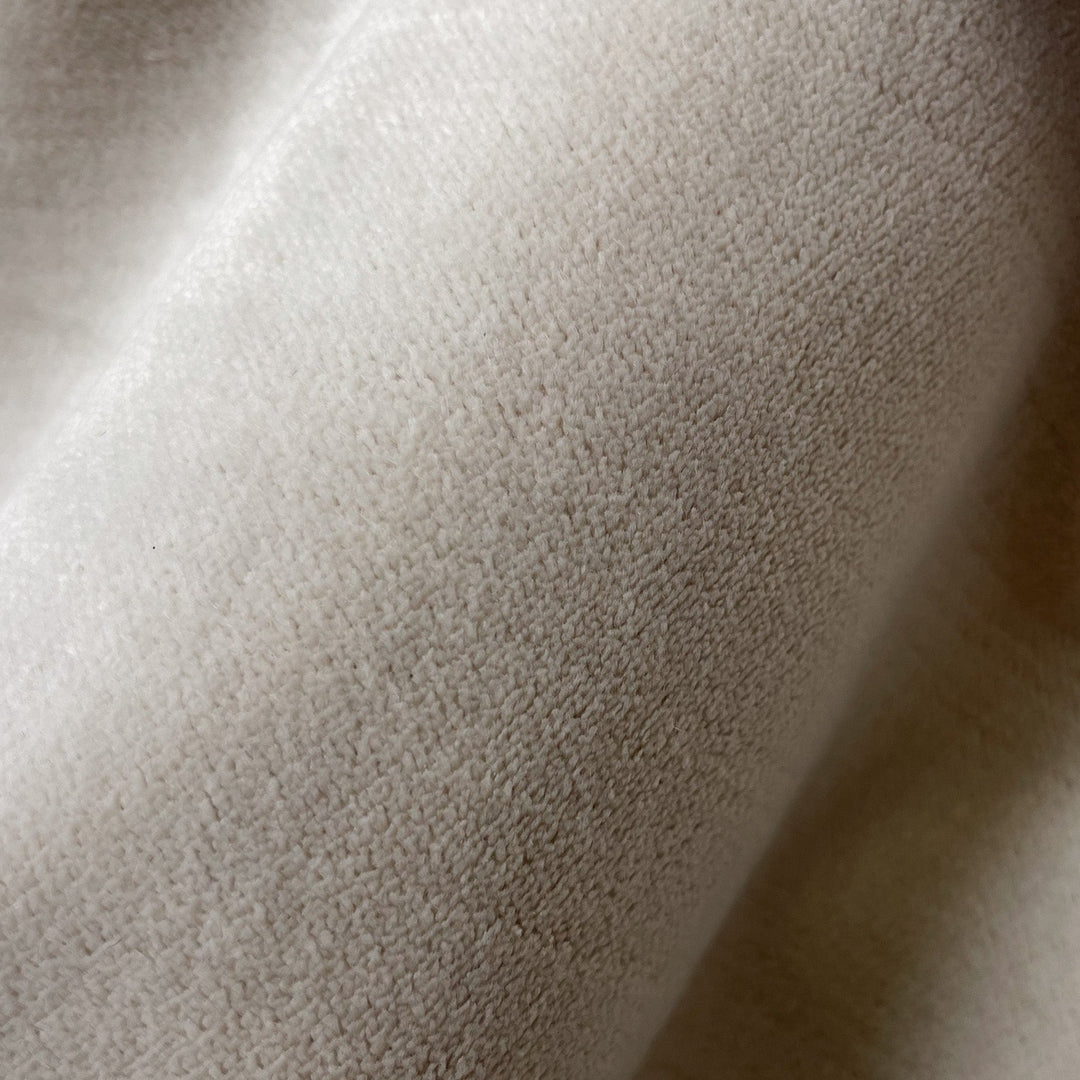 Close-up fabric swatch of Velvet Cream, a warm cream velvet with a short, dense pile