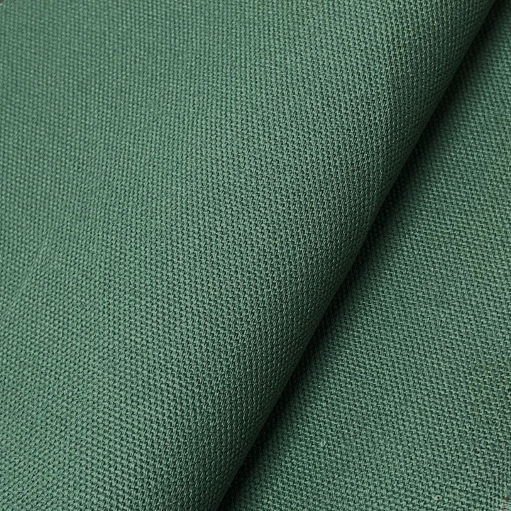 Close-up of forest green cotton canvas fabric texture