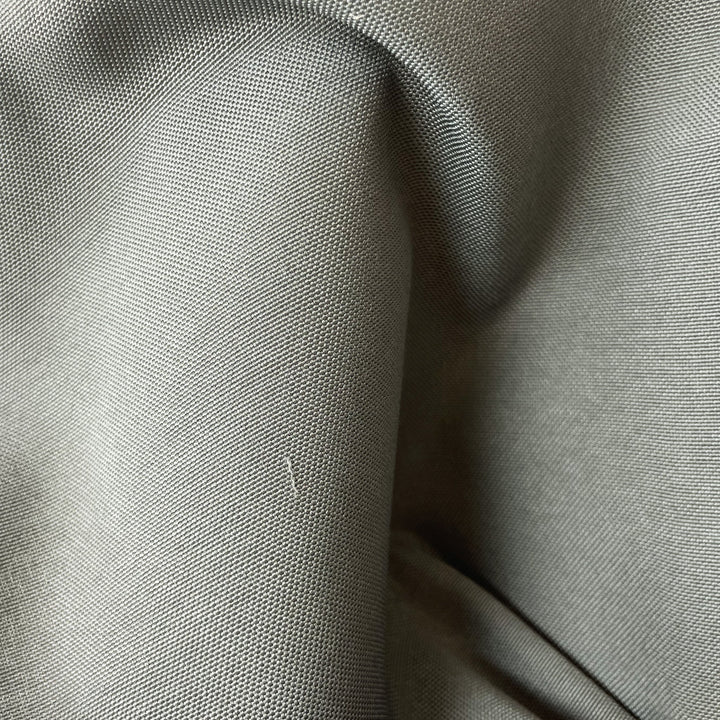 Close-up fabric swatch of Cool Gray Outdoor Performance, a solid cool gray indoor-outdoor performance weave